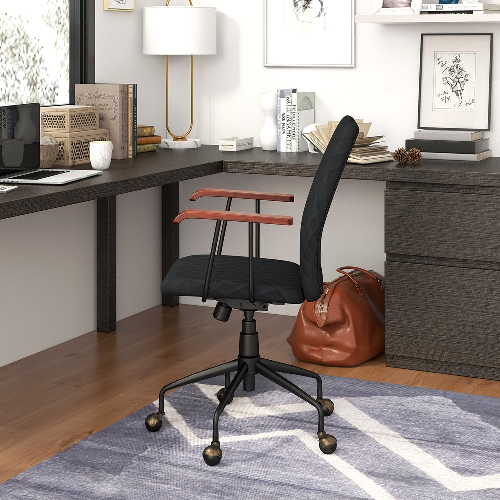 The office chair viewed from the side while placed in a home study area with a corner desk