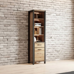 Tall wooden cabinet with glass panels against a brick wall