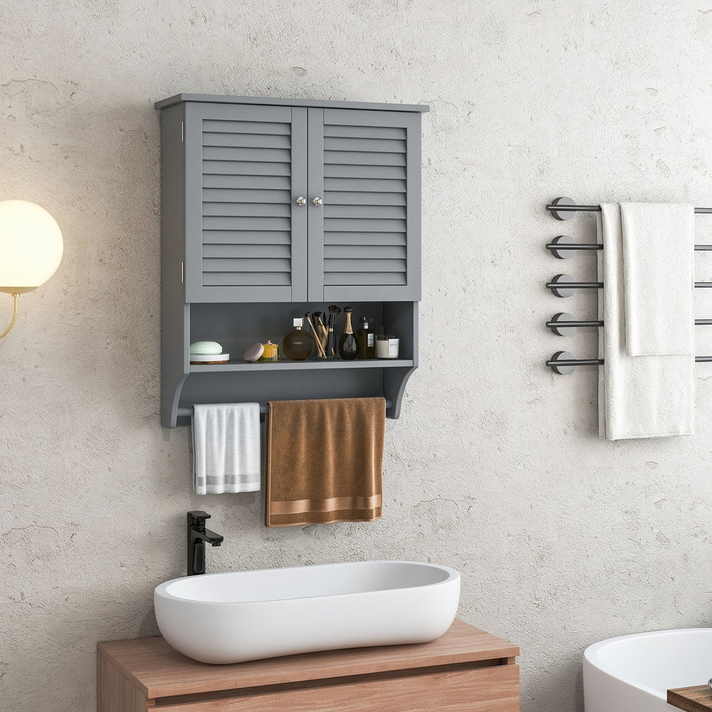 Grey bathroom wall cabinet with louvered doors, shown above a sink with towels