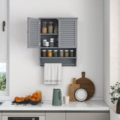 Grey wall cabinet with two doors, open to reveal shelves stocked with jars and cups