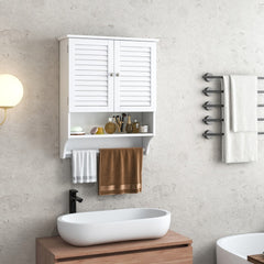 The wall cabinet is shown in a bathroom setting above a sink, with towels and toiletries displayed