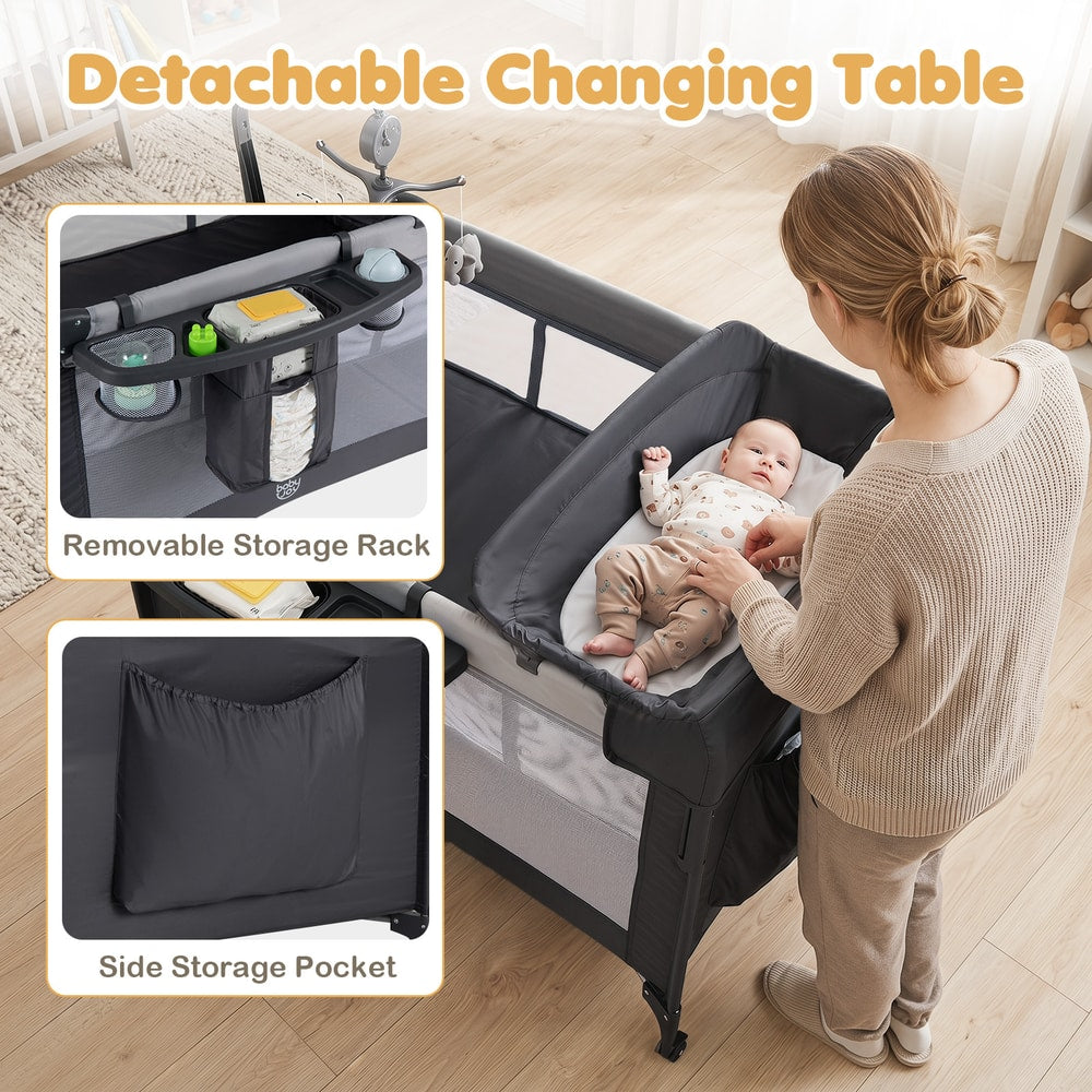 The infant bed with a mother changing a baby on the detachable changing table