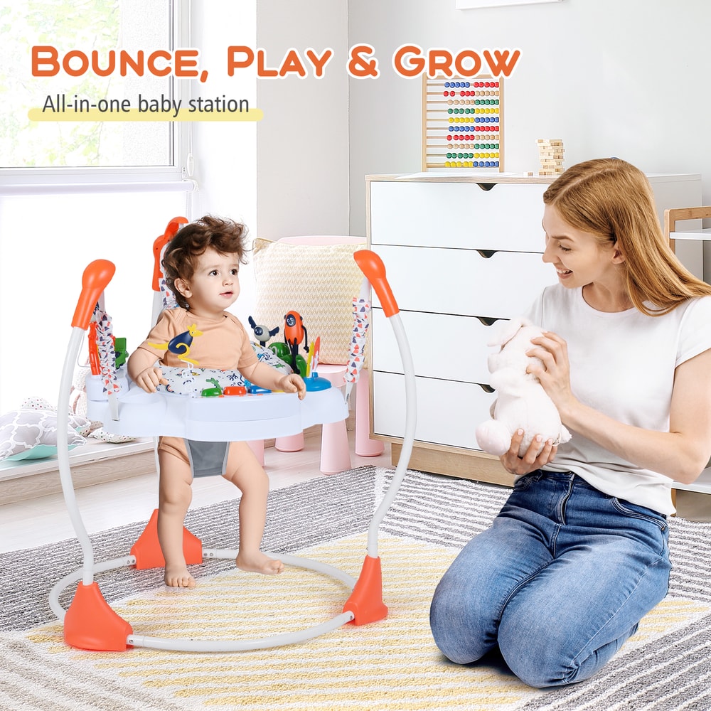 A mother plays with her baby in the orange baby jumper and bouncer in a nursery room