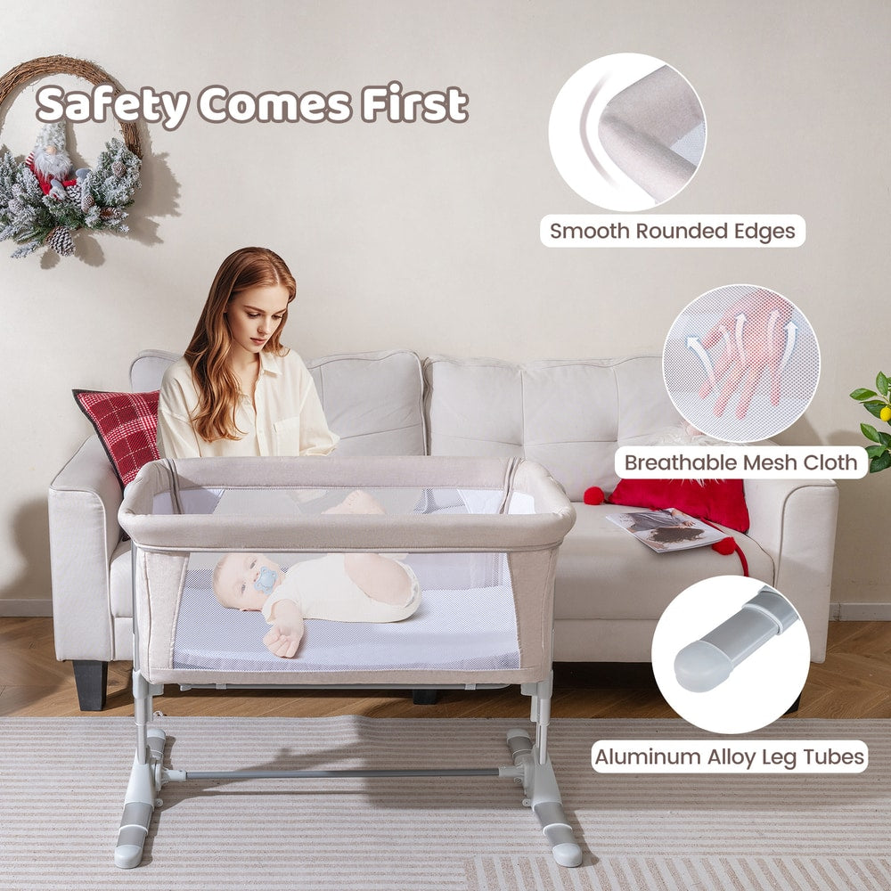 The baby bassinet with circular insets showing the mesh fabric and rounded edges