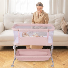 The bassinet is positioned in front of a sofa with a baby sleeping inside and a woman behind