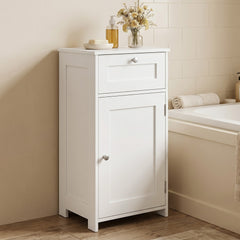 The floor cabinet placed next to a bathtub with toiletries on the surface