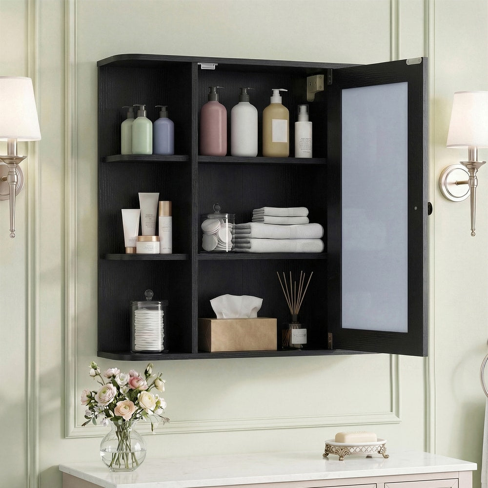 The black wall cabinet with mirror with its door open, revealing three internal shelves with toiletries