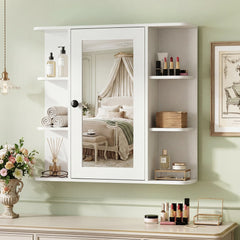 White bathroom cabinet with mirror and shelves styled with toiletries and decor