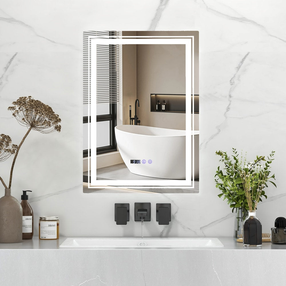 The bathroom vanity mirror with illuminated border shown in a modern bathroom setting with a bathtub