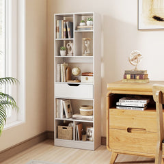 The white bookcase with a drawer and eight open cubes placed in a study next to a wooden desk