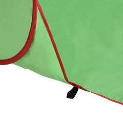 A close-up view of the green fabric and red trim on the base of the beach shelter