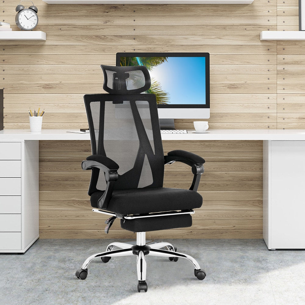 The office chair is shown in a home office setting with a computer on the desk
