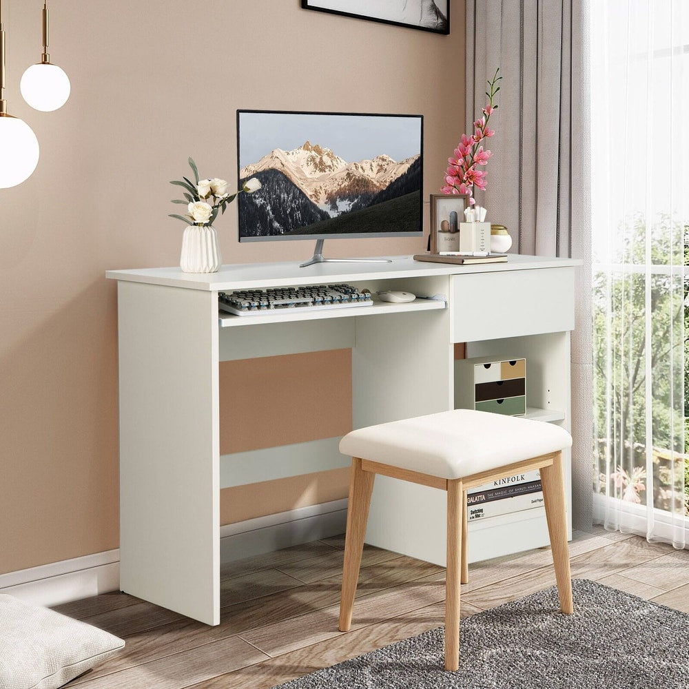 White computer desk with a computer and a stool in a room setting