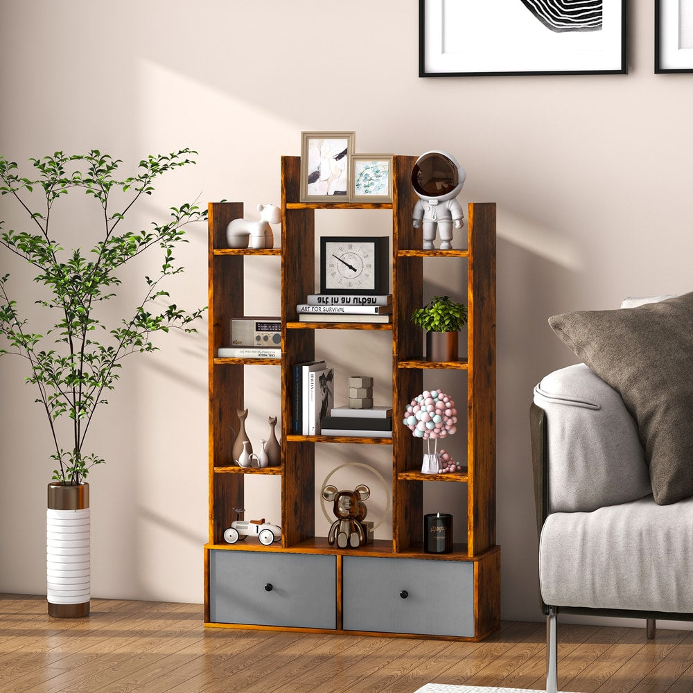 The wooden bookshelf with folding drawer styled with books and ornaments in a living room setting