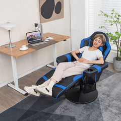 The gaming chair reclined with a person sitting in it while working at a desk