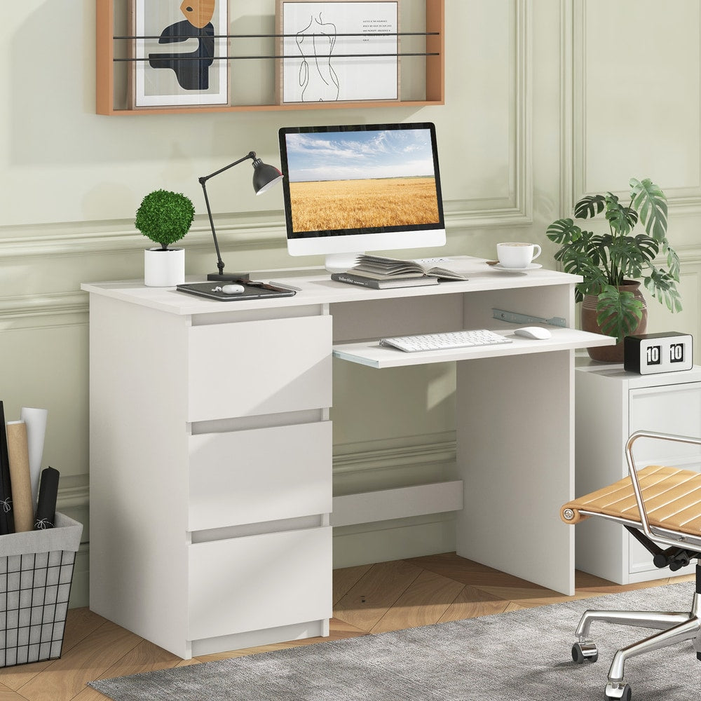 White office desk with three drawers and a keyboard tray, shown in a home office setting with a computer and chair