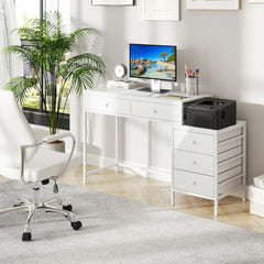 The office desk set up in a bright home workspace with a computer and chair