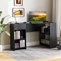 The black computer desk with storage, shown from the side with a computer and plant