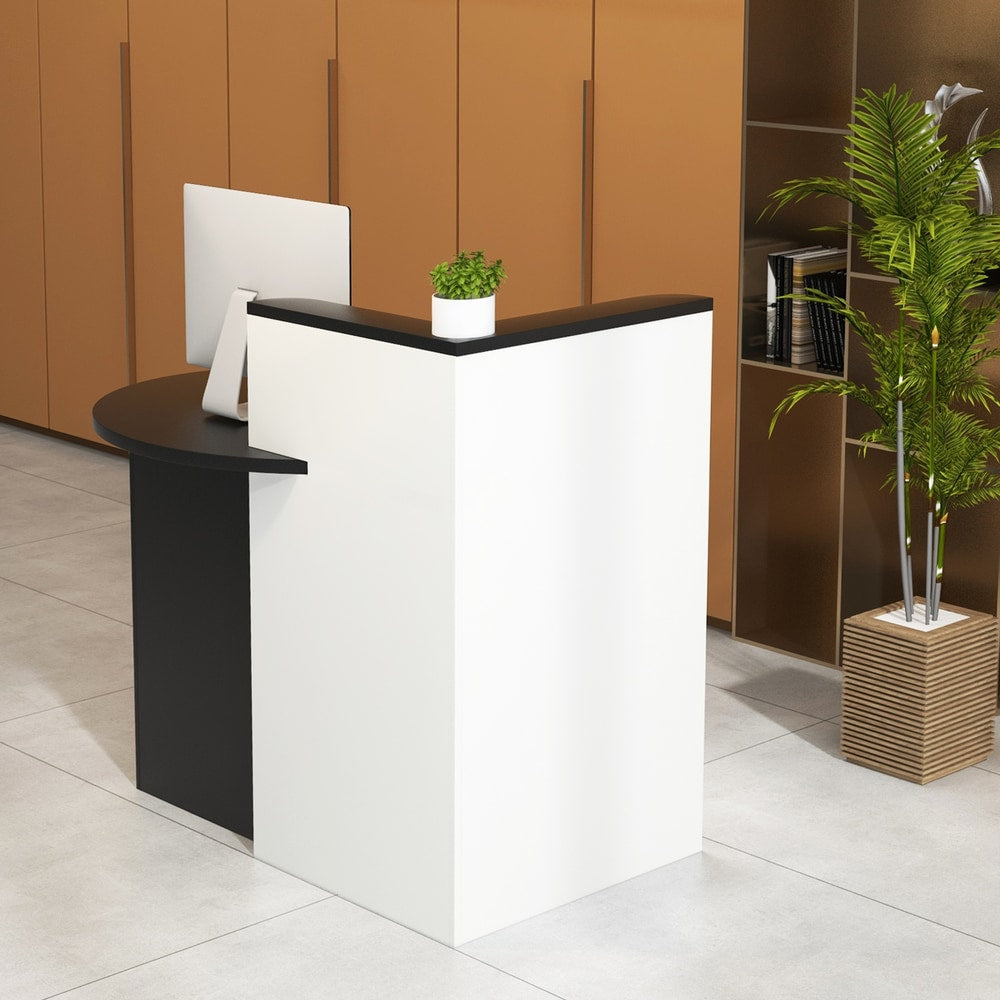 The black and white reception counter desk in a modern office setting