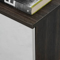 The entertainment unit corner shows the contrast between the dark wood top and white marble door