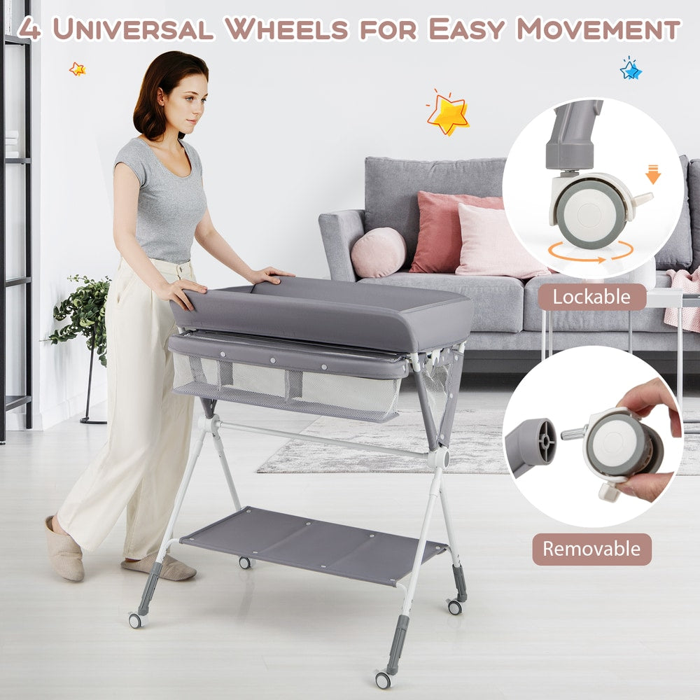A woman demonstrating the lockable and removable wheels on the changing table