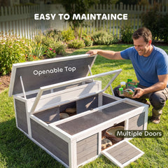 A man opening the top of the tortoise house to show multiple doors and easy maintenance