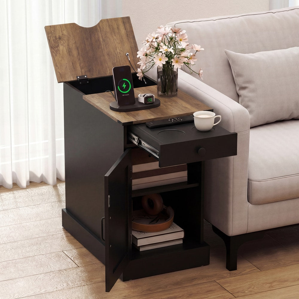 The black nightstand with its drawer open and door ajar, showing storage