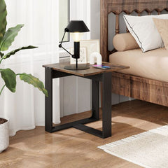 The industrial nightstand in a bedroom next to a bed