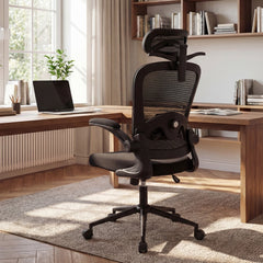 The office chair positioned behind a wooden desk in a bright home study room