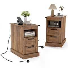 Two rustic brown nightstands with charging cables plugged in, one with a lamp and book