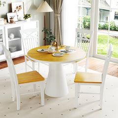Four farmhouse dining chairs around a round table in a living area