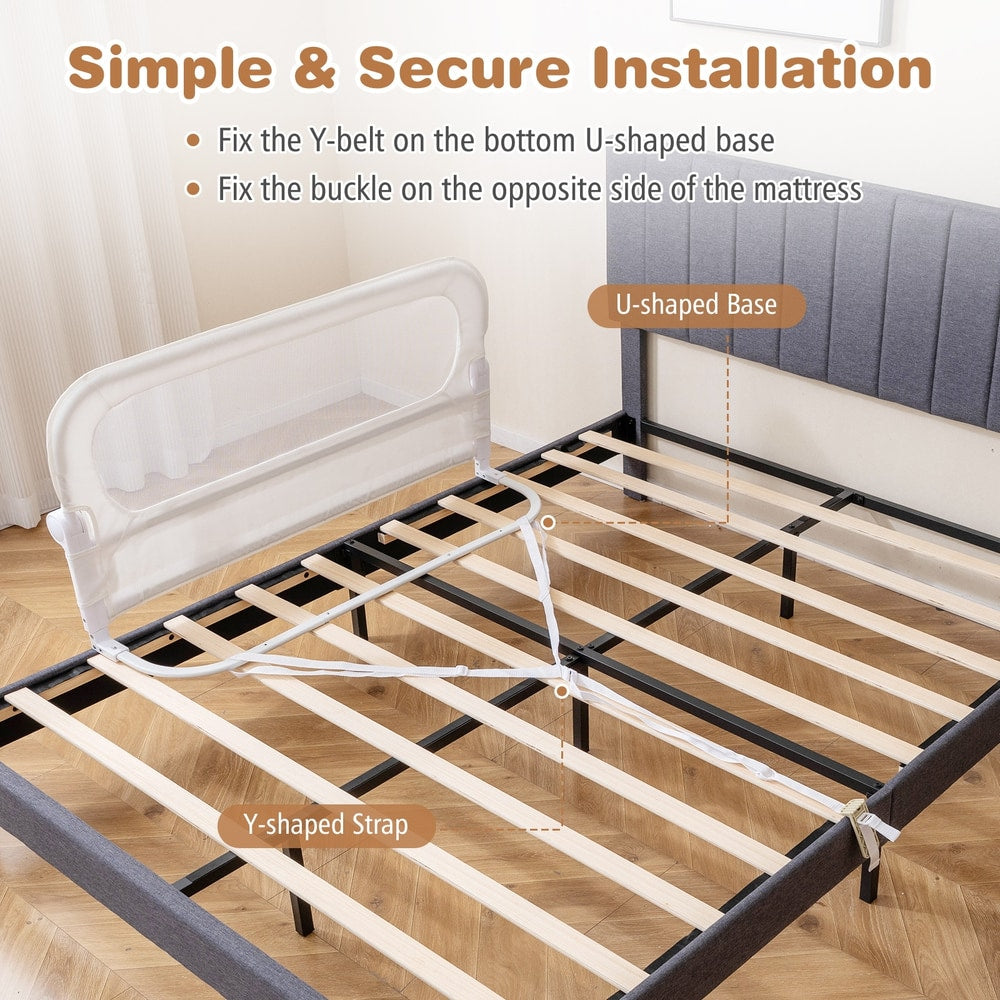 The bed rail showing the strap and base mechanism for securing to a bed frame
