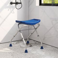 The blue bath safety seat is positioned in a tiled shower cubicle