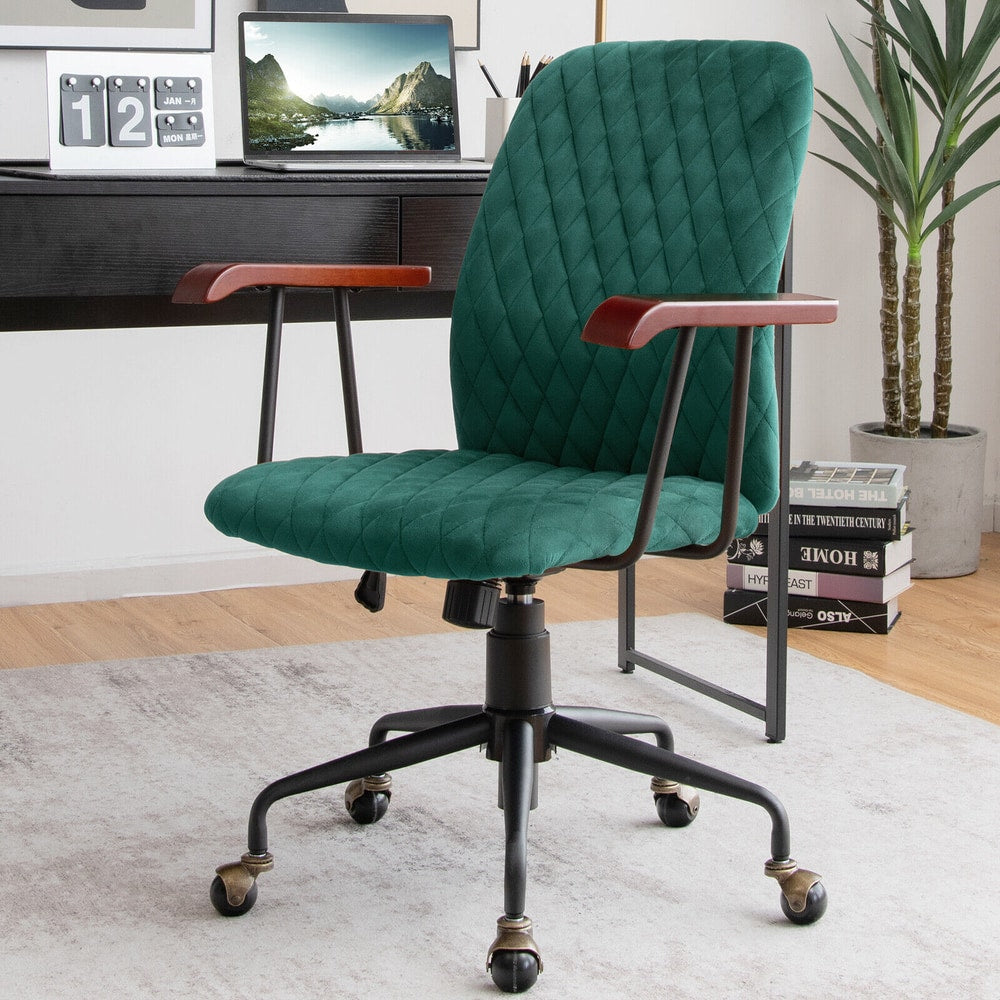 The green velvet office chair placed in a home office with books and plants