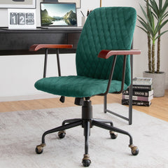 The green velvet office chair placed in a home office with books and plants