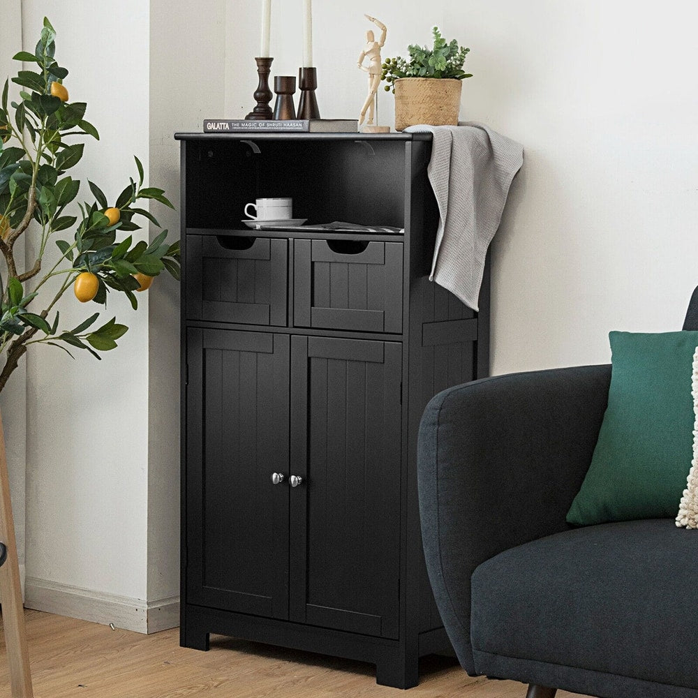 The floor cabinet styled in a living room with books and decor on the open top shelf