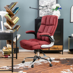 The office chair viewed from the side in a decorated room with a bookshelf