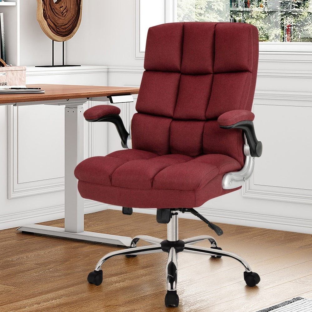 The office chair positioned in a bright home office next to a wooden desk