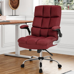 The office chair positioned in a bright home office next to a wooden desk