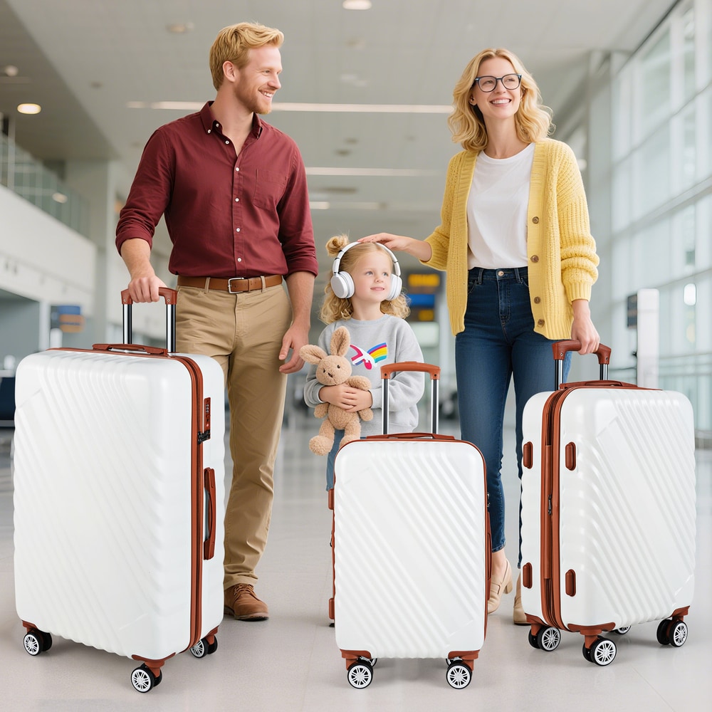 Family with three white suitcases in an airport terminal