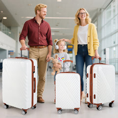 Family with three white suitcases in an airport terminal