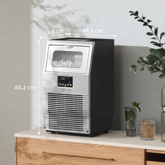 The commercial ice maker is shown on a countertop with dimensions