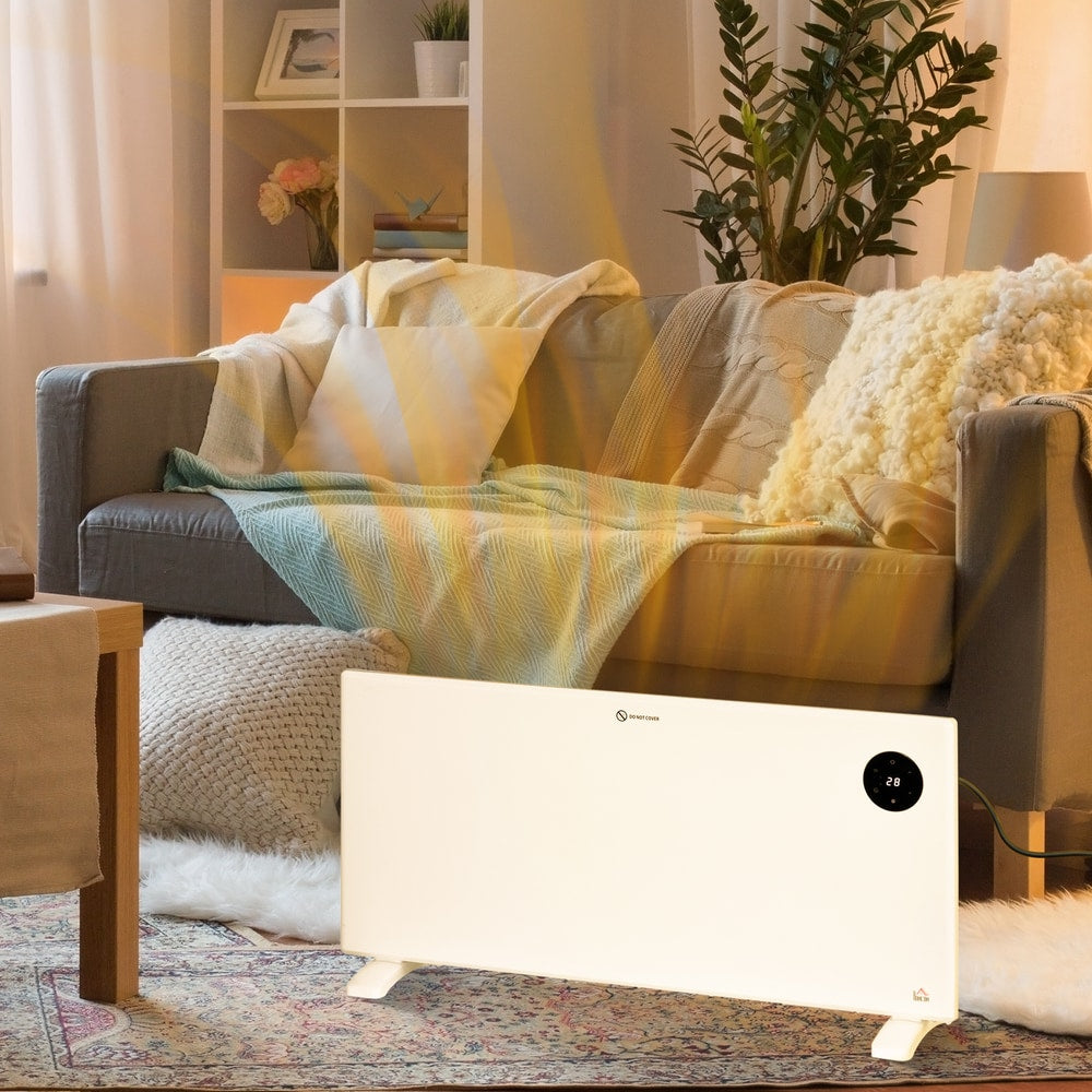 The electric convector heater warming a living room with a sofa and rug