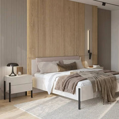 The dressing table as a bedside table next to a bed