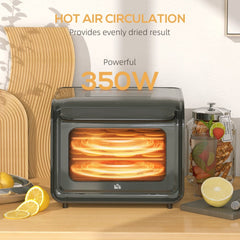 Black six-tray food dehydrator with the interior illuminated, showing hot air circulation