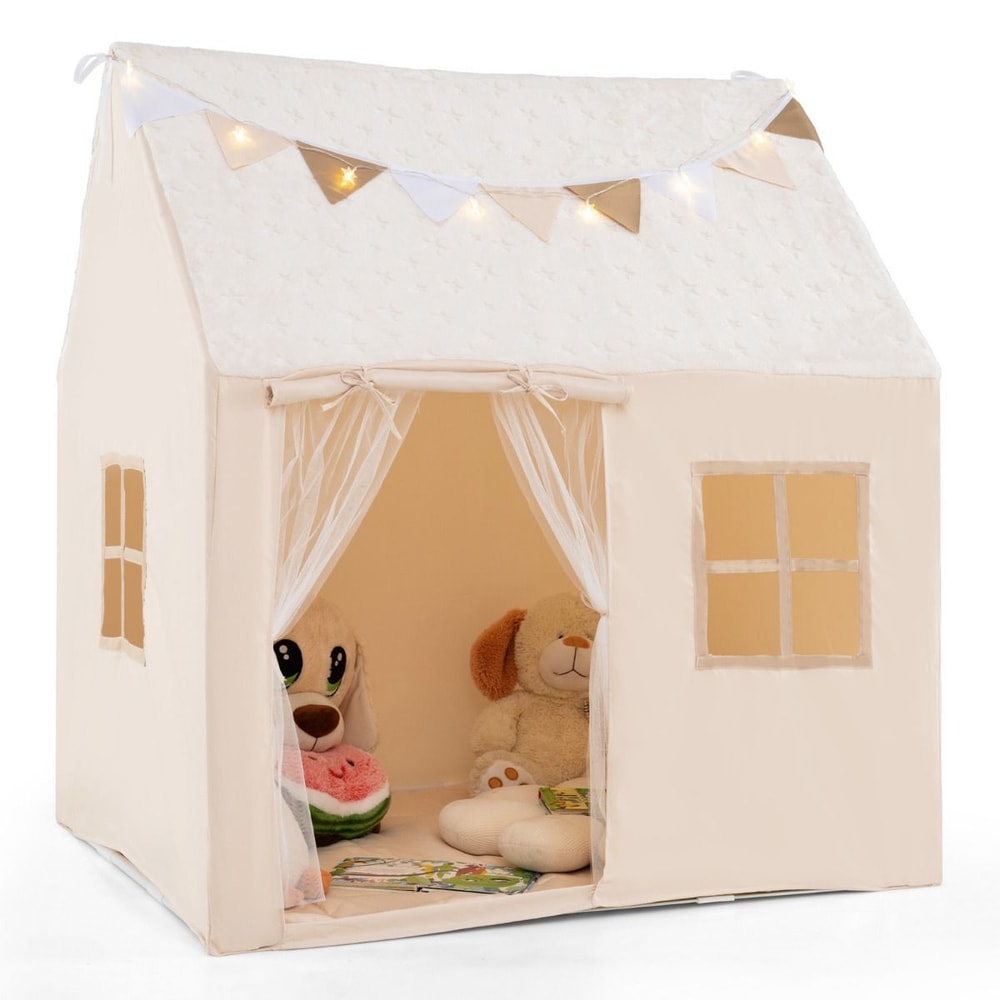 The fabric playhouse with star lights and soft toys inside the open front entrance