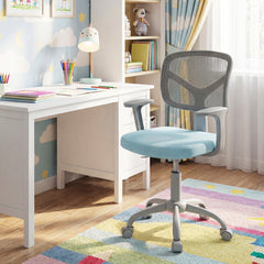 The blue kids desk chair is placed in a child's bedroom setting