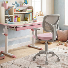 The pink kids desk chair is positioned at a child's desk in a bright room