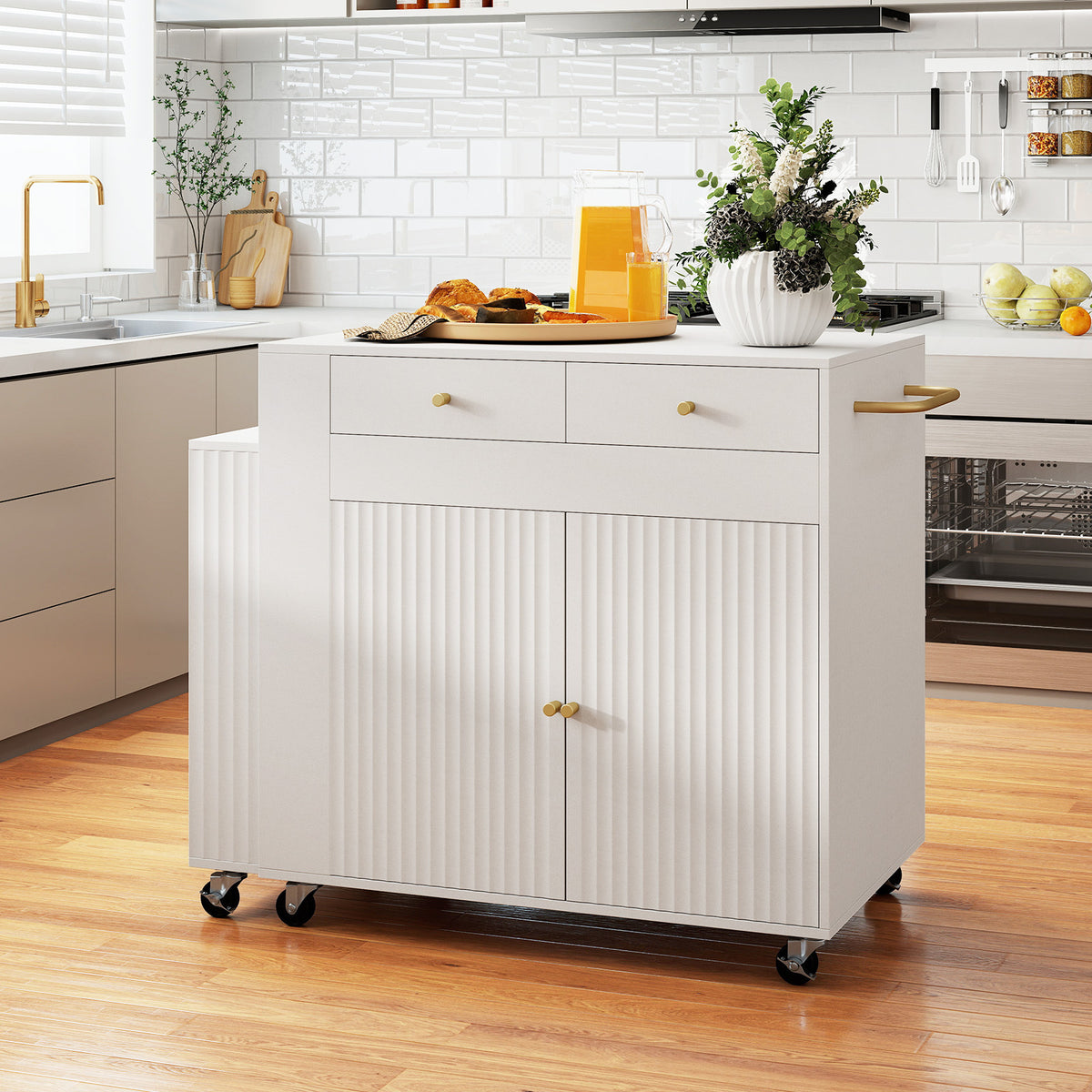 White kitchen island with two fluted doors and two drawers, with a countertop and side shelves