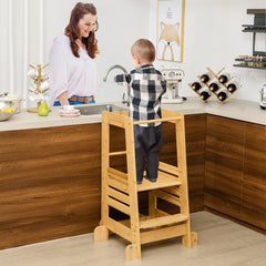 Toddler and adult at the kitchen counter with the step stool